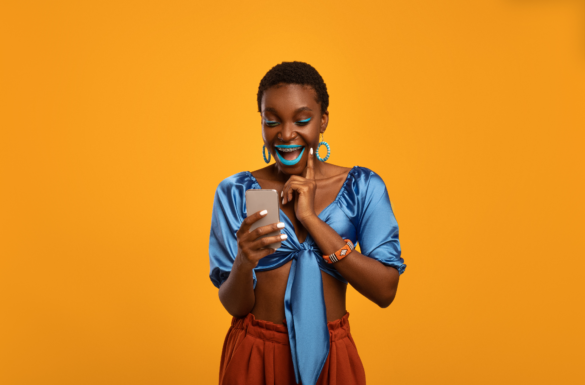 emotional-black-woman-in-bright-outfit-using-smart-2021-12-09-20-11-08-utc - Perfectly Imperfect Digital